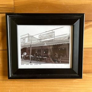 Black wooden picture frame, glass with art